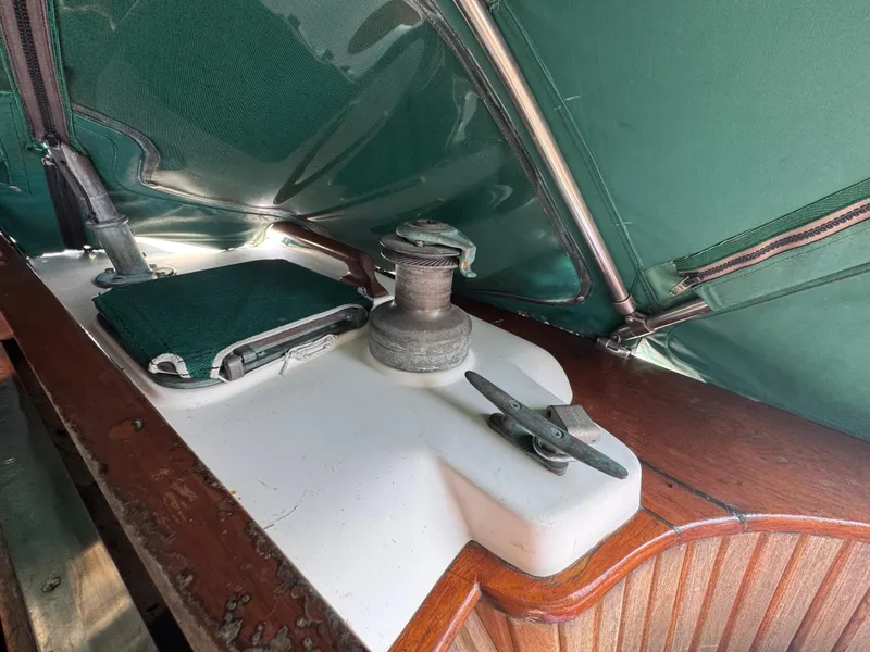 Slide: The Image of 1989 Hans Christian 43T sailboat deck with winch and cleat under green canopy. - 33