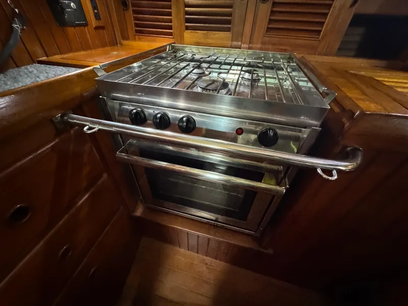 Slide: The Image of Stainless steel stove and oven in 1989 Hans Christian 43T yacht galley. - 38