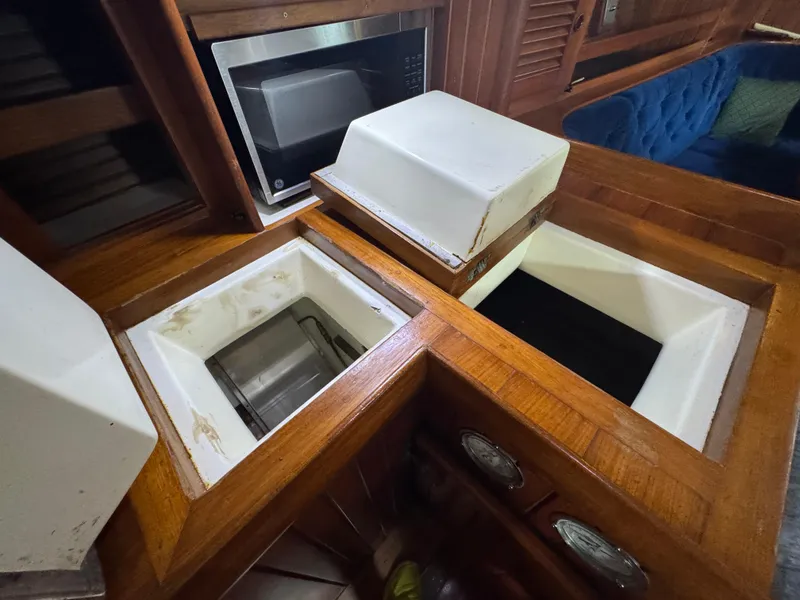 Slide: The Image of Interior of 1989 Hans Christian 43T yacht with wooden cabinetry and built-in microwave. - 40