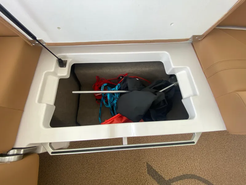 Slide: The Image of Storage compartment in 2020 MasterCraft X26 boat with ropes and equipment. - 21