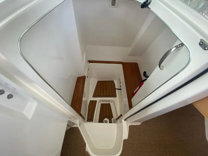 Slide: The Image of 2020 MasterCraft X26 boat interior with teak flooring and modern design. - 27