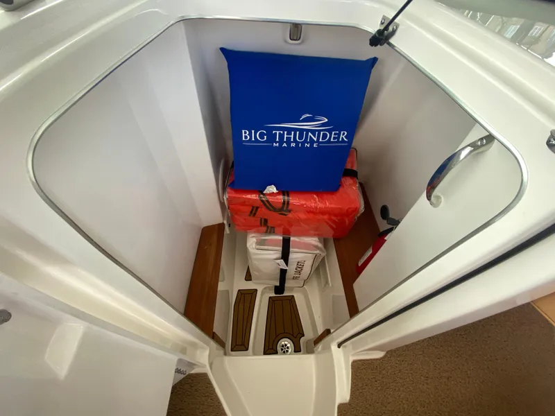 Slide: The Image of 2020 MasterCraft X26 storage area with Big Thunder Marine gear and safety equipment. - 28
