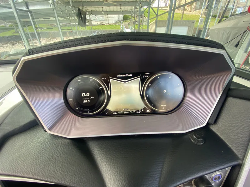 Slide: The Image of 2020 MasterCraft X26 dashboard with digital display and gauges. - 34