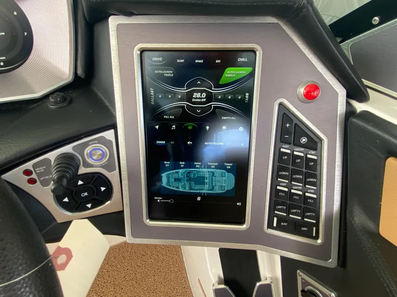 Slide: The Image of 2020 MasterCraft X26 boat dashboard with touchscreen controls and navigation display. - 35
