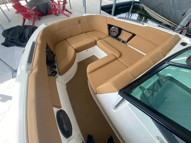 Slide: The Image of 2020 MasterCraft X26 boat interior with tan seating and modern design. - 39