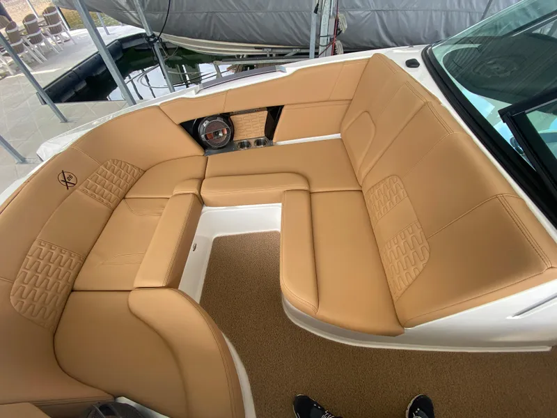 Slide: The Image of 2020 MasterCraft X26 boat interior with tan leather seating and modern design. - 40