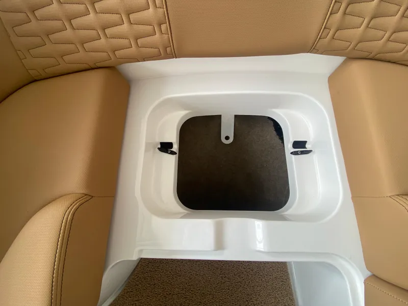 Slide: The Image of 2020 MasterCraft X26 boat interior storage compartment with tan upholstery. - 43