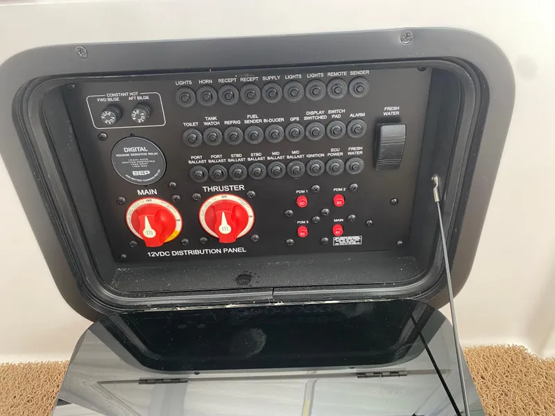 Slide: The Image of Control panel of a 2020 MasterCraft X26 boat, featuring switches and dials. - 47
