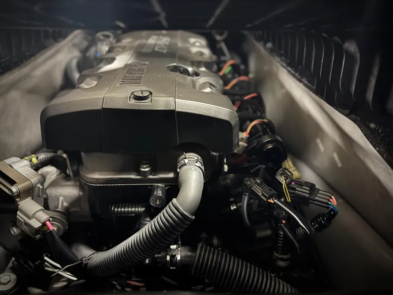 Slide: The Image of 2023 Yamaha WaveRunner GP1800R engine close-up, showcasing intricate components and wiring. - 10
