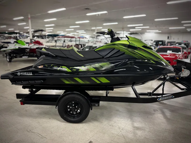 Slide: The Image of 2023 Yamaha WaveRunner GP1800R in showroom, vibrant green and black design. - 3
