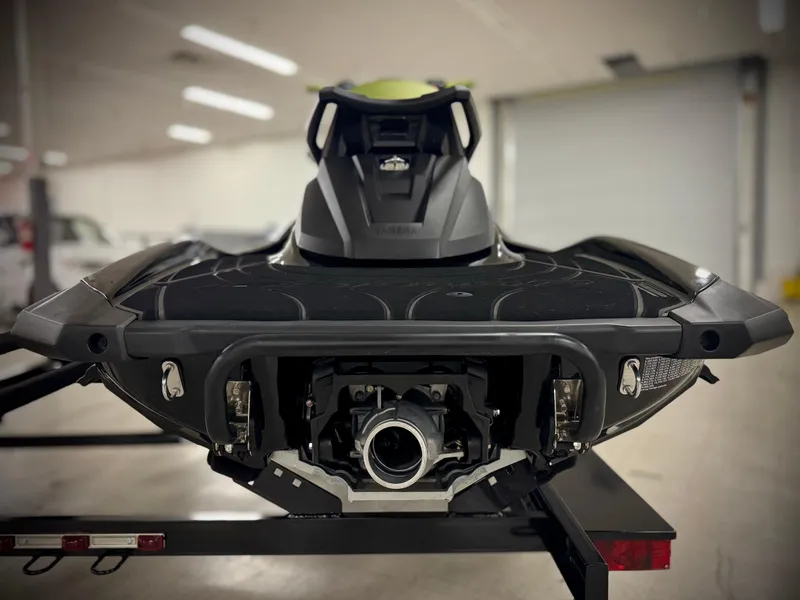 Slide: The Image of 2023 Yamaha WaveRunner GP1800R jet ski rear view in a garage setting. - 5