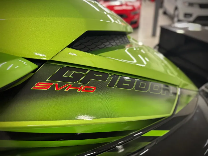 Slide: The Image of 2023 Yamaha WaveRunner GP1800R SVHO in vibrant green, close-up view. - 6