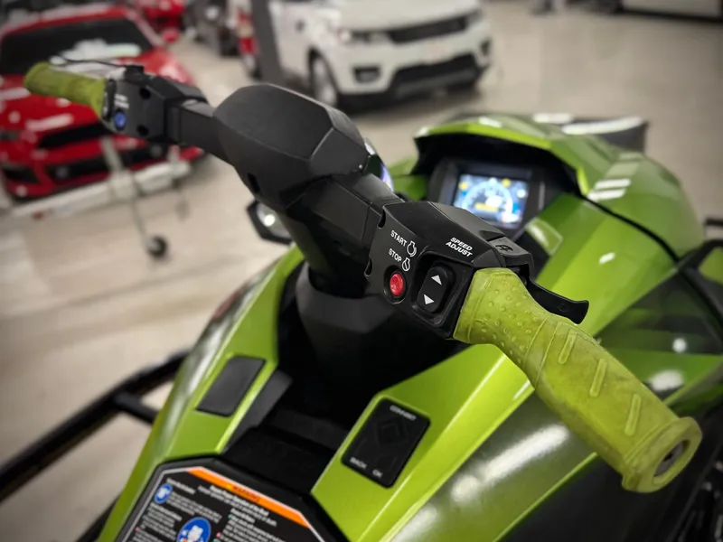 Slide: The Image of 2023 Yamaha WaveRunner GP1800R, green handlebars, close-up view in showroom. - 7