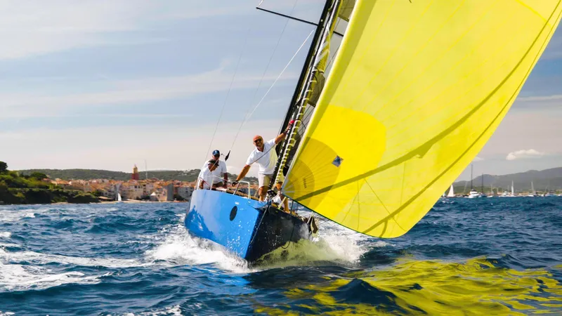 Slide: The Image of Sailing yacht Black Pepper Code 0.1, 2025 model, with vibrant yellow sail on open sea. - 10