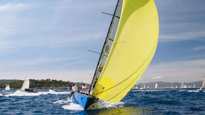 Slide: The Image of Sailboat "Black Pepper Code 0.1" 2025 model with yellow sail on open sea. - 11