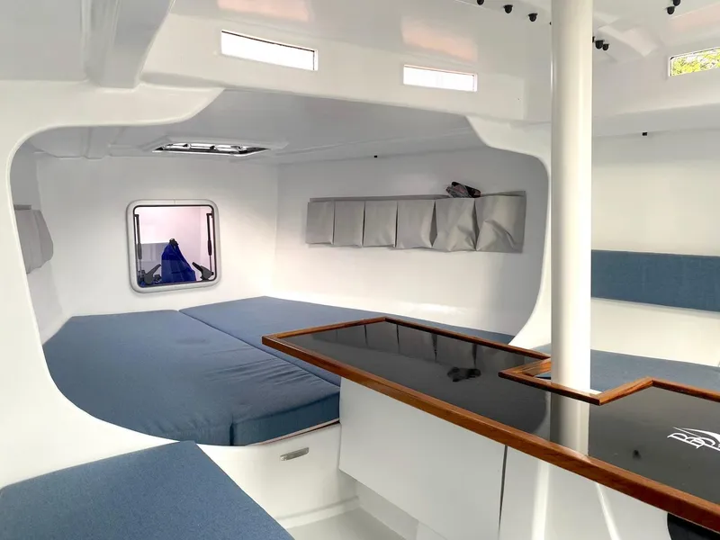 Slide: The Image of Modern yacht interior with blue seating, sleek design, and natural light, Black Pepper Code 0.1, 2025. - 22