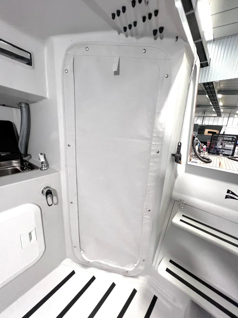 Slide: The Image of Interior of Black Pepper Code 0.1 yacht, featuring sleek white design and modern fixtures, 2025 model. - 24