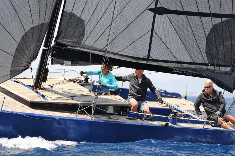 Slide: The Image of Sailboat Black Pepper Code 0.1, 2025 model, with crew navigating in open water. - 3