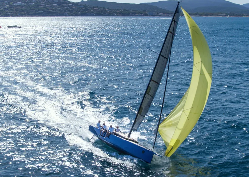 Slide: The Image of Sailing yacht "Black Pepper Code 0.1" 2025 gliding on blue ocean with yellow sail. - 6