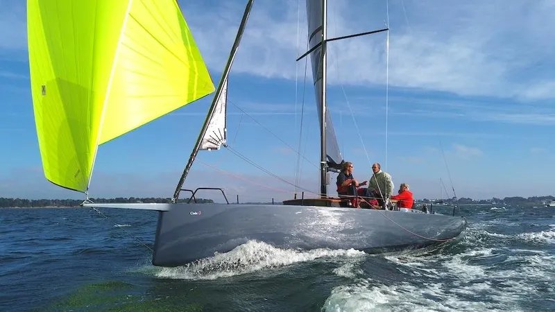 Slide: The Image of Sleek Black Pepper Code 0.1 sailboat with vibrant yellow sail on open water, 2025 model. - 7