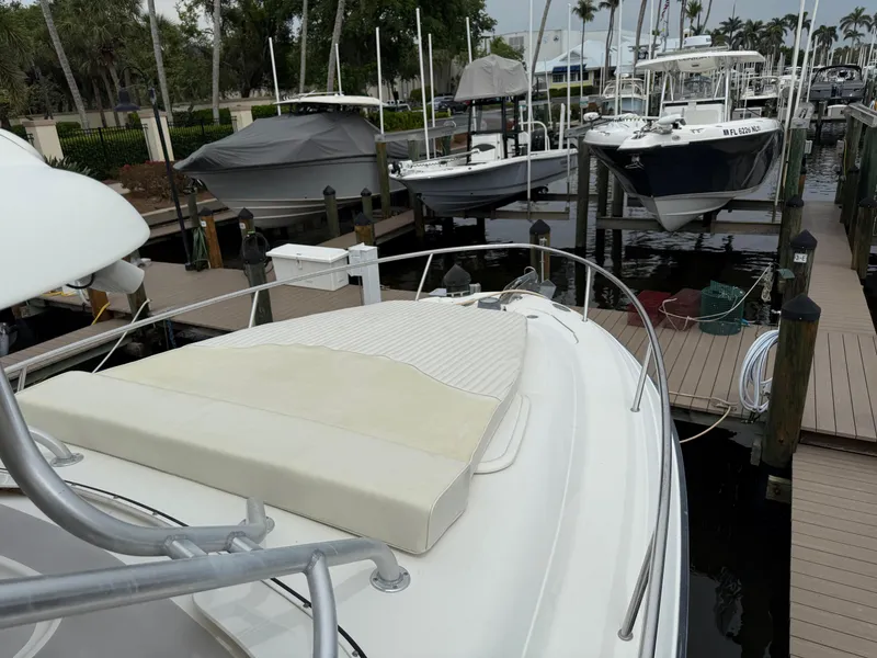 Slide: The Image of 2005 Hydra-Sports Vector 3300 VX docked at a marina with other boats. - 12