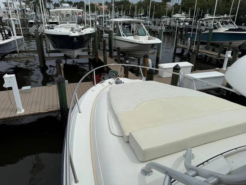 Slide: The Image of 2005 Hydra-Sports Vector 3300 VX docked at marina with other boats. - 13