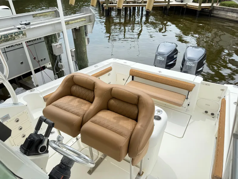 Slide: The Image of 2005 Hydra-Sports Vector 3300 VX boat interior with dual seats and twin engines. - 18