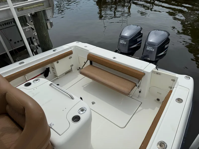 Slide: The Image of 2005 Hydra-Sports Vector 3300 VX boat with twin Yamaha 300 engines, featuring tan seating. - 19