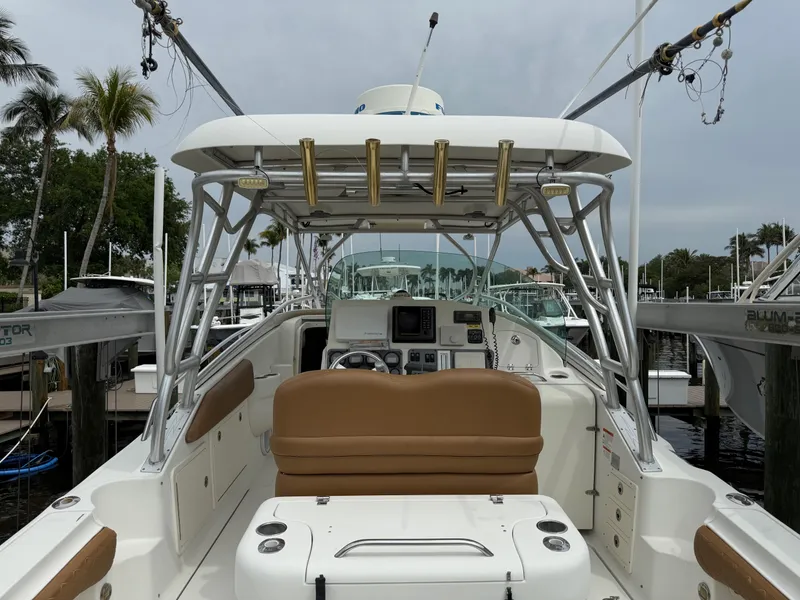 Slide: The Image of 2005 Hydra-Sports Vector 3300 VX boat interior with helm and seating at marina. - 22