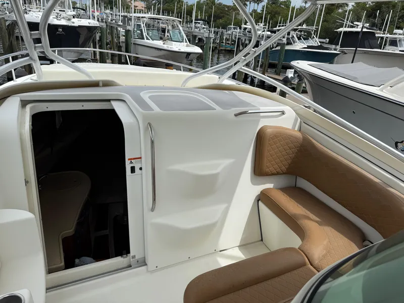Slide: The Image of 2005 Hydra-Sports Vector 3300 VX boat interior with tan seating and cabin entrance. - 29