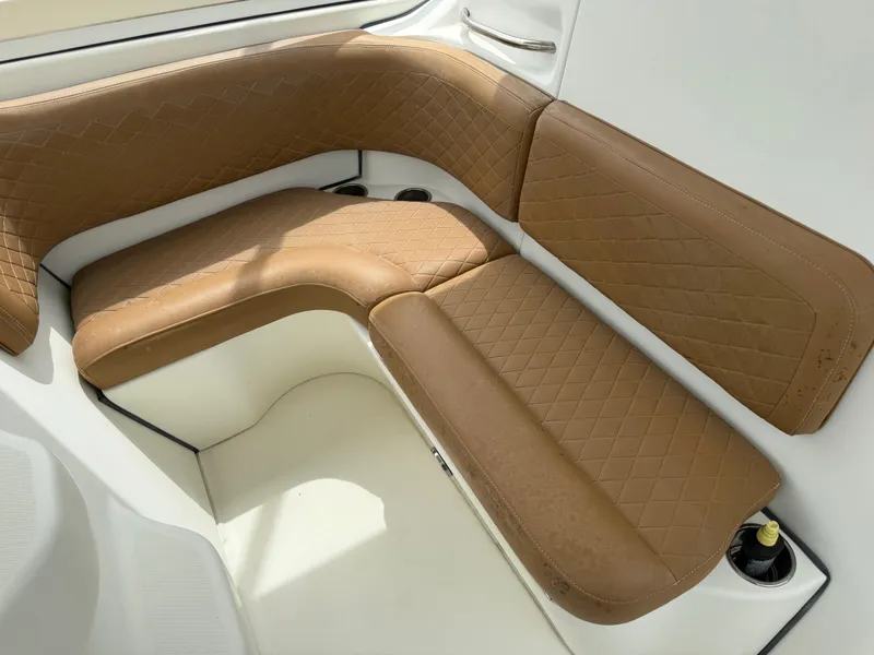 Slide: The Image of 2005 Hydra-Sports Vector 3300 VX boat interior with brown leather seating. - 31