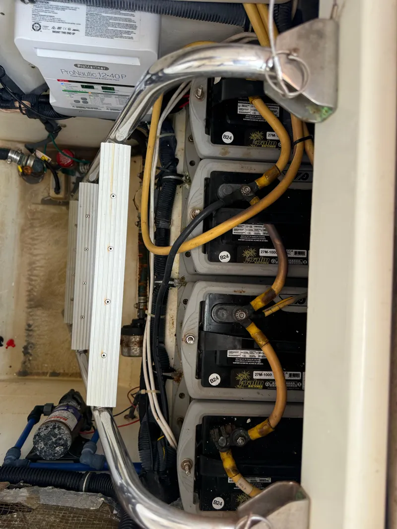 Slide: The Image of 2005 Hydra-Sports Vector 3300 VX battery compartment with multiple batteries and wiring. - 34