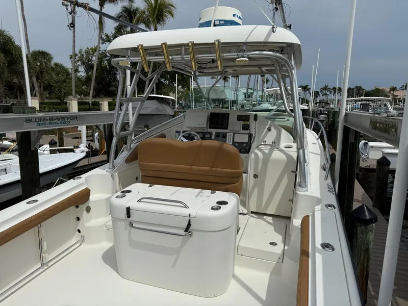 Slide: The Image of 2005 Hydra-Sports Vector 3300 VX boat docked, featuring spacious seating and fishing rod holders. - 36