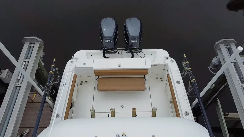 Slide: The Image of 2005 Hydra-Sports Vector 3300 VX boat with dual engines, docked at a marina. - 4