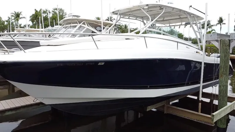 Slide: The Image of 2005 Hydra-Sports Vector 3300 VX boat docked in marina, side view. - 6