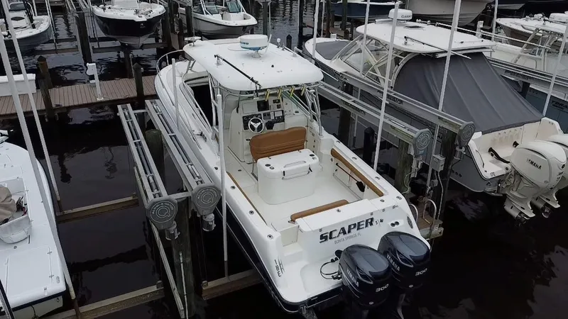 Slide: The Image of 2005 Hydra-Sports Vector 3300 VX boat docked with twin engines, aerial view. - 8