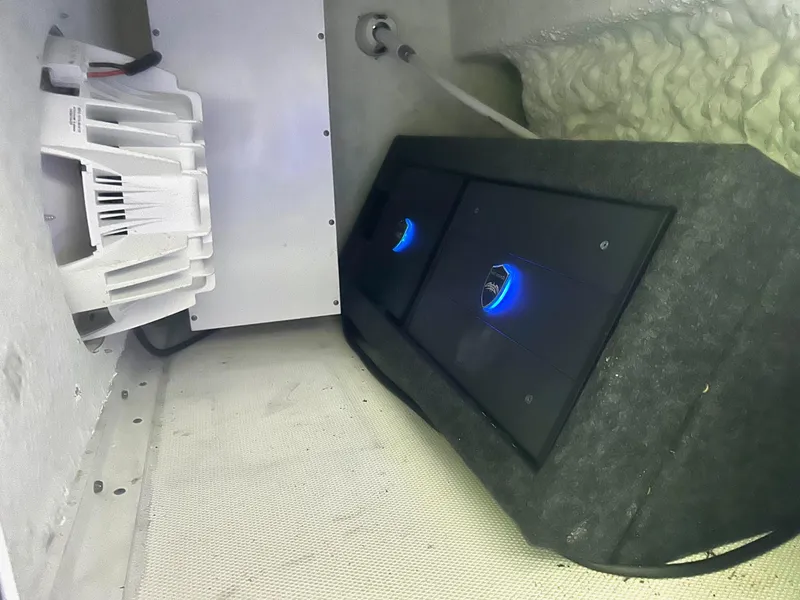 Slide: The Image of 2020 Sea Hunt Ultra 275 SE boat interior with audio system and subwoofers. - 11