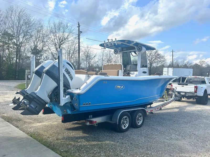 Slide: The Image of 2020 Sea Hunt Ultra 275 SE boat on trailer, featuring dual Yamaha engines. - 3