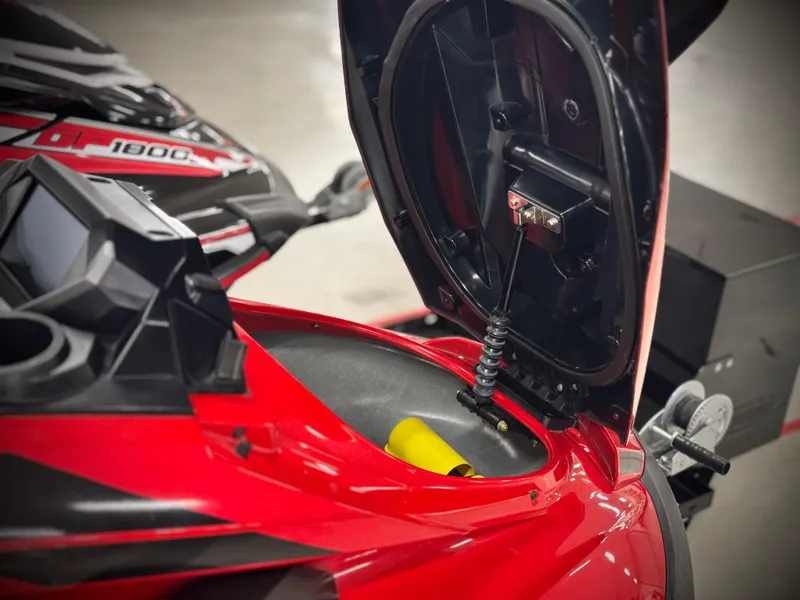 Slide: The Image of 2022 Yamaha WaveRunner FX Cruiser SVHO with open storage compartment, showcasing sleek red design. - 14