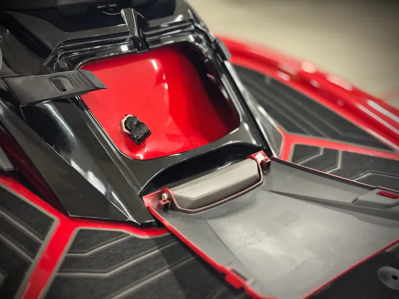 Slide: The Image of 2022 Yamaha WaveRunner FX Cruiser SVHO storage compartment, open with red and black design. - 17