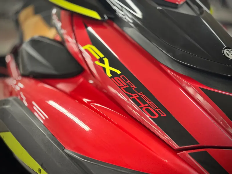 Slide: The Image of 2022 Yamaha WaveRunner FX Cruiser SVHO, red and black design, close-up view. - 7