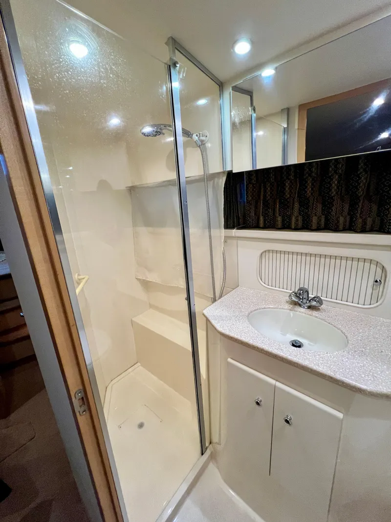 Slide: The Image of Bathroom in 1998 Carver 405 Aft Cabin yacht with shower and sink. - 19