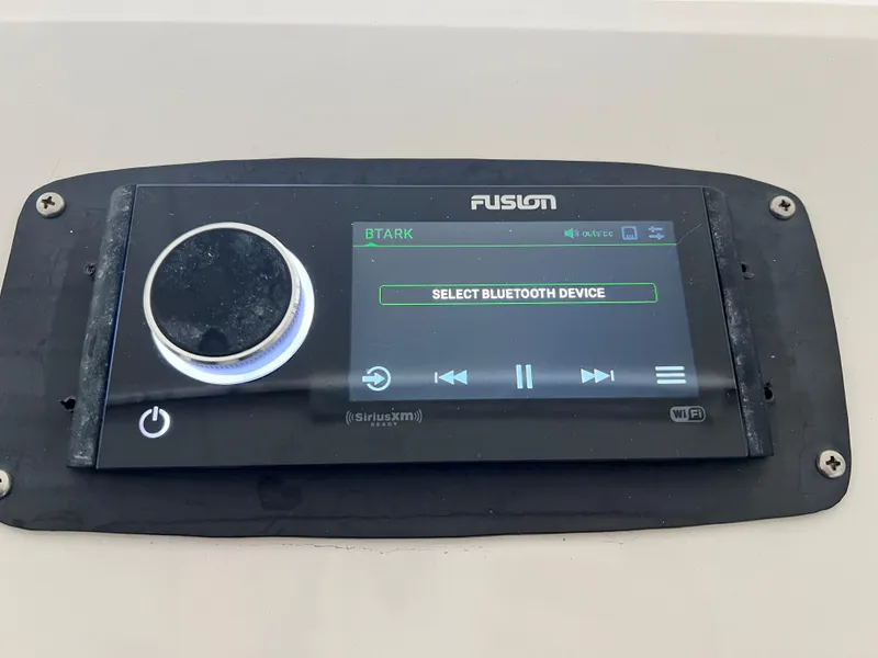 Slide: The Image of Fusion audio system on 1998 Carver 405 Aft Cabin, displaying Bluetooth device selection. - 32