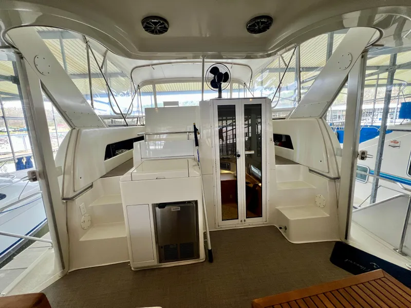 Slide: The Image of 1998 Carver 405 Aft Cabin yacht interior with seating and storage. - 36