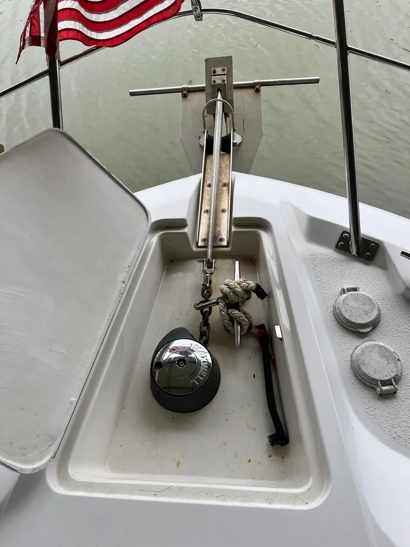 Slide: The Image of Anchor compartment of 1998 Carver 405 Aft Cabin with American flag. - 40