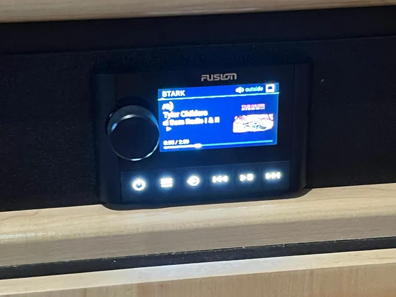 Slide: The Image of Fusion stereo system displaying music on Carver 405 Aft Cabin, 1998 model. - 42