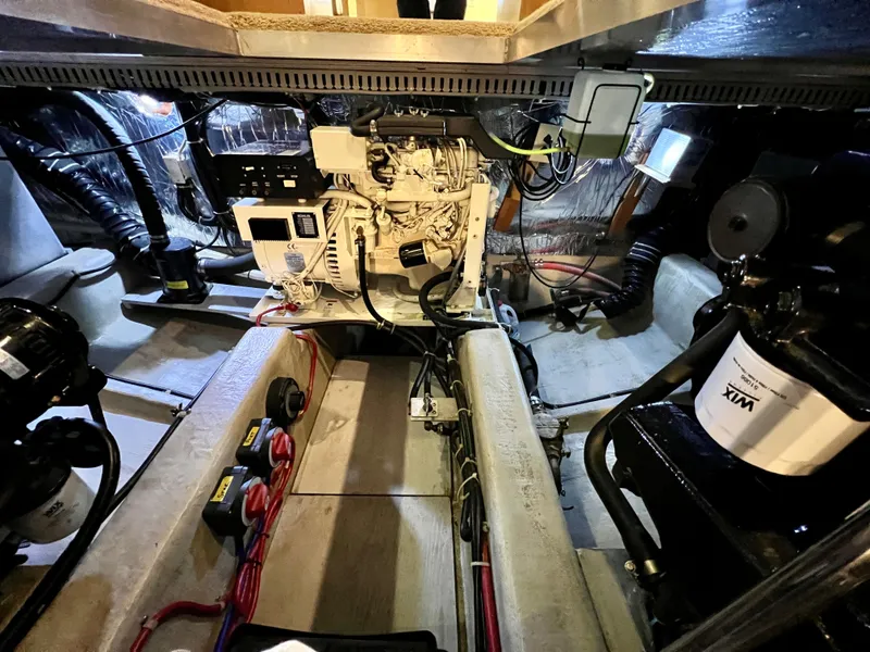 Slide: The Image of Engine room of a 1998 Carver 405 Aft Cabin yacht, showcasing mechanical components. - 45