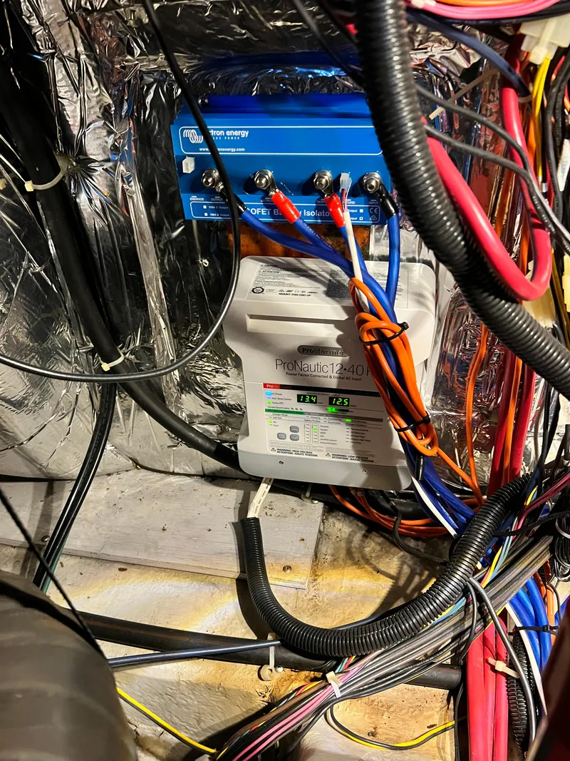 Slide: The Image of Electrical wiring and components inside a 1998 Carver 405 Aft Cabin boat. - 48