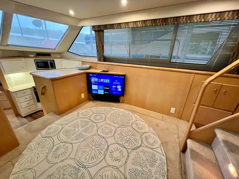 Slide: The Image of Luxurious interior of 1998 Carver 405 Aft Cabin yacht with modern amenities and stylish decor. - 6