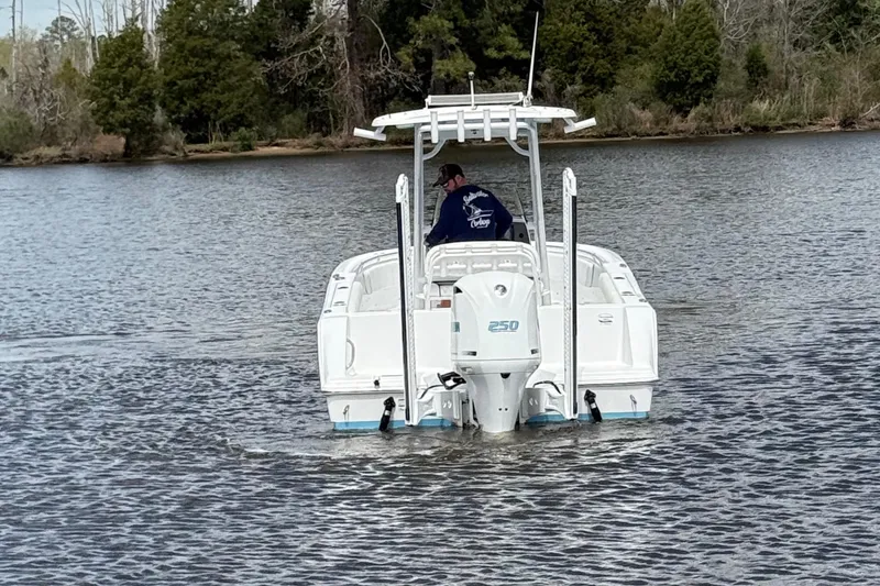 Slide: The Image of 2021 Sportsman Heritage 231 Center Console boat on a calm lake. - 10